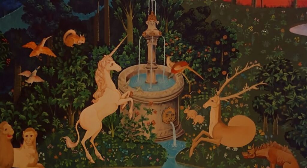 Enchanted garden scene with unicorn, deer, and mythical creatures gathered around a central fountain surrounded by lush greenery and flowers