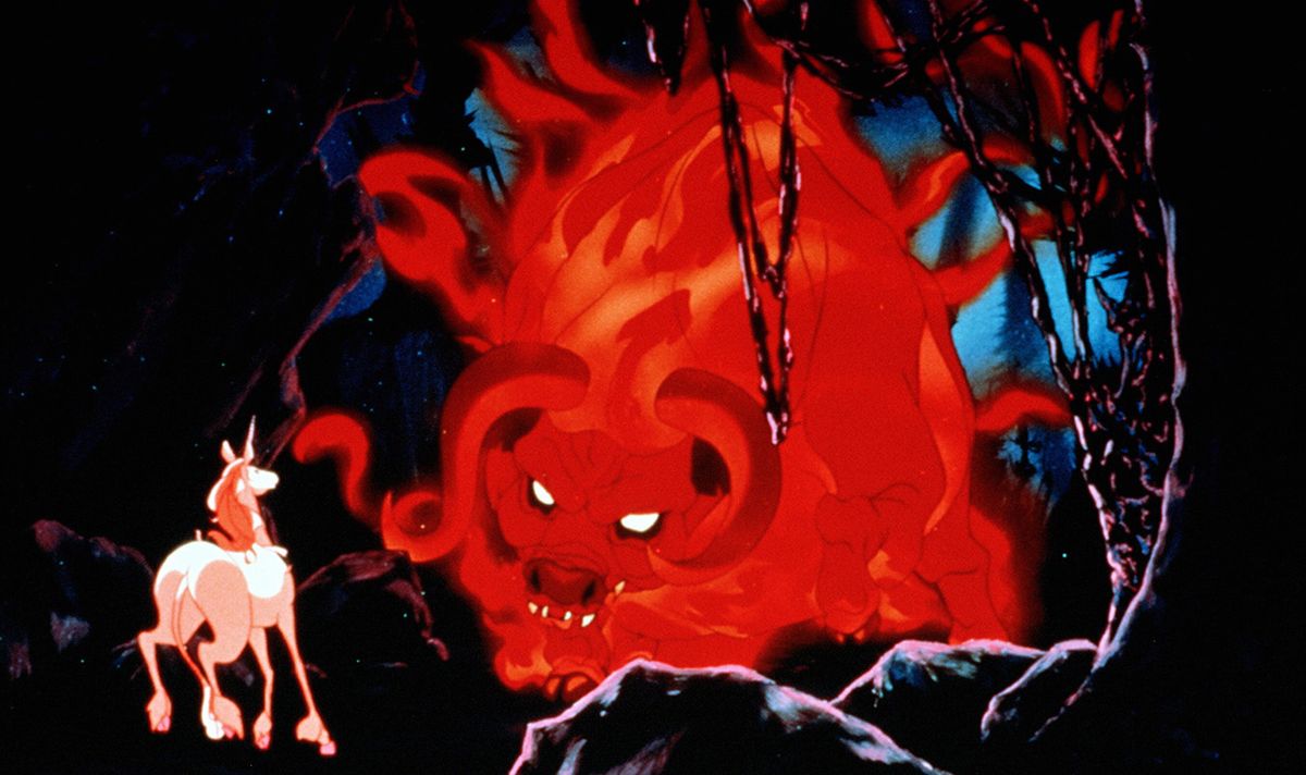 A pale unicorn stands alone facing a massive glowing red demon-like creature with curled horns in a dark, cavernous setting from an animated fantasy film